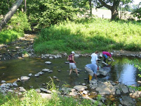 RappFLOW volunteers collecting water samples in Rush River in July 2006.